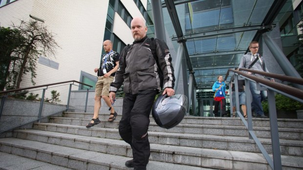Workers leave Microsoft's office, in Oulu, Finland.