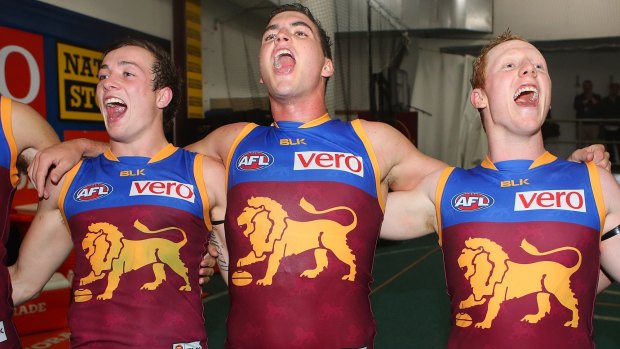 Lewy Taylor, Tom Rockliff and Josh Green sing the song after beating Port Adelaide.