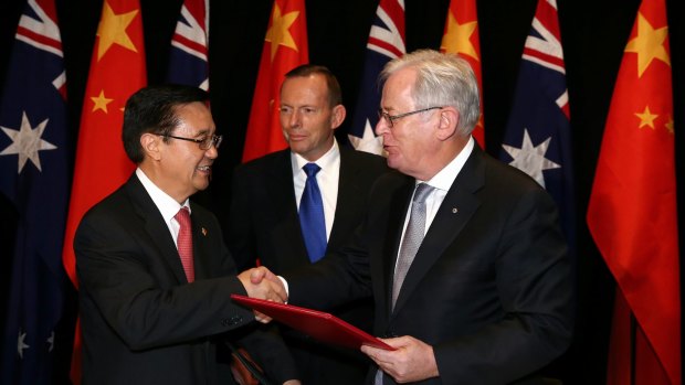 Chinese Commerce Minister Gao Hucheng, former prime minister Tony Abbott and then trade minister Andrew Robb at the signing of the China-Australia free trade agreement in June 2015. 