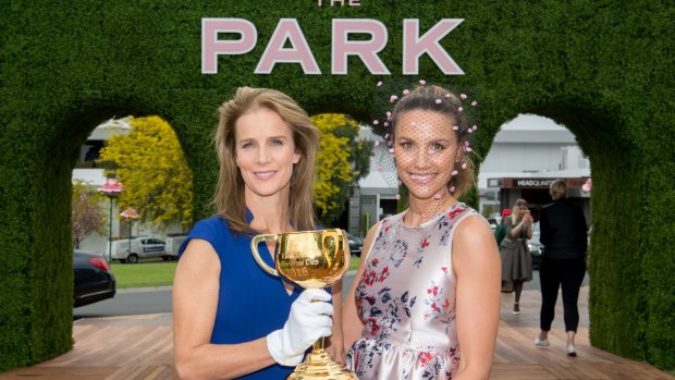 Actor and filmmaker Rachel Griffiths (left) and model and TV personality Rachael Finch with the Melbourne Cup at the launch of the carnival at Flemington's new  Park area on Monday.