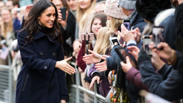 Meghan Markle greets the public en route to visiting the Terrence Higgins Trust World AIDS Day charity fair in Nottingham.