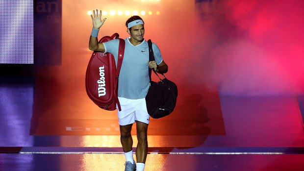 Roger Federer of Switzerland walks onto the court in Perth on Monday.