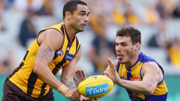 Hawthorn's Shaun Burgoyne gets past Luke Shuey of the Eagles.