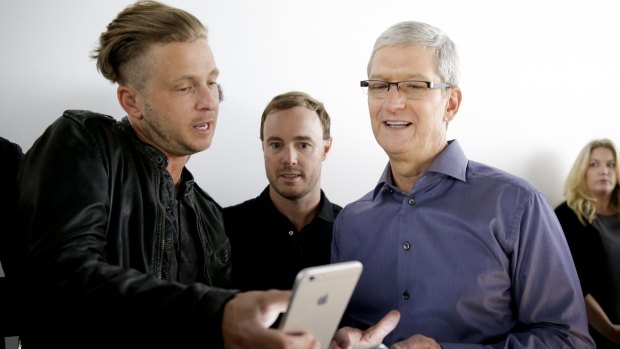 OneRepublic lead singer Ryan Tedder, seen here with Tim Cook, seems impressed.