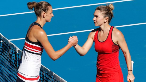 Too strong: Simona Halep shakes hands with Karolina Pliskova after their quarter-final.