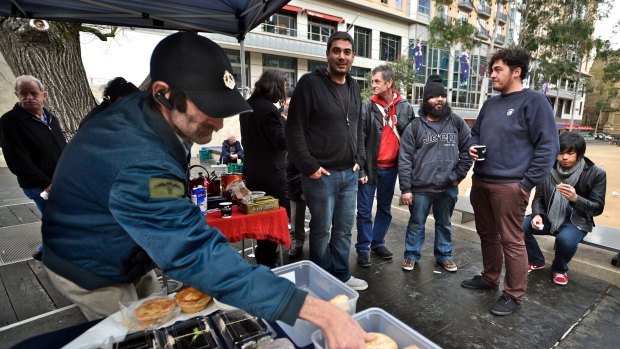 Greg Geering (centre) at the city food stall.