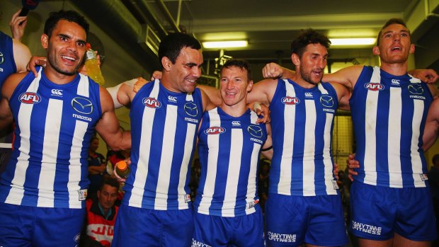 Jarrad Waite (second from right) celebrates the Fremantle win with his teammates.
