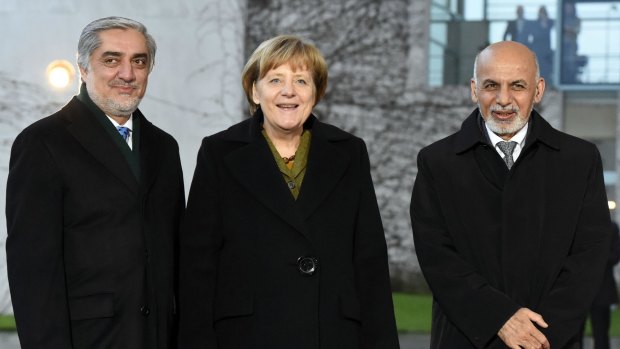 Uneasy partners: The European Union is reluctant to rock the boat now shared by Dr Ghani (right) and his "chief executive" Abdullah Abdullah (left), seen here during a visit to Berlin on December 5.