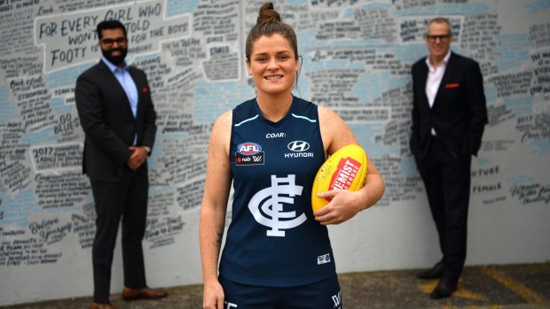 Tarang Chawla, Brianna Davey and Carlton CEO Steven Trigg ahead of the 'Carlton Respects' game, aimed at promoting a club against family violence. 