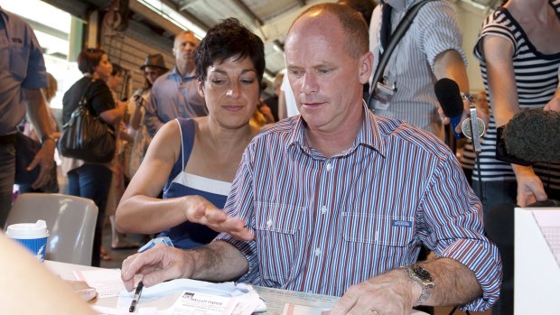Campbell and Lisa Newman at a polling booth for the 2012 election.
