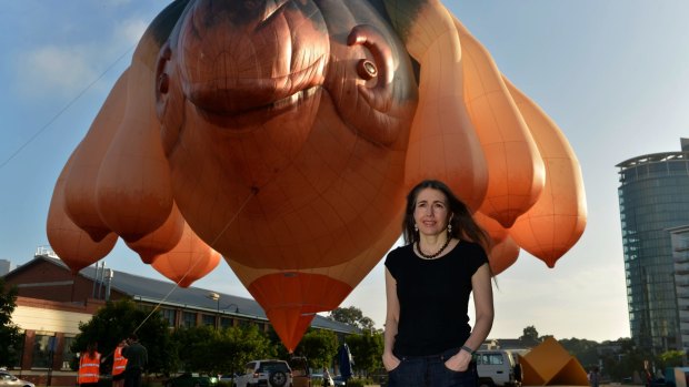Patricia Piccinini with the Skywhale, which has hundreds of hours of flying time left.