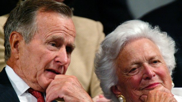 Former president George H.W. Bush and former first lady Barbara Bush listen as their son accepts the party nomination at the Republican National Convention in New York, 2004. 