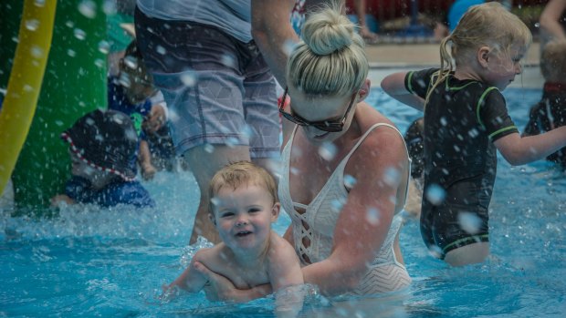 Cooling off at the Babies Day Out' event is fun for Chantelle and Levi Mundy of Latham.