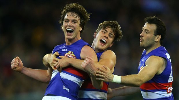 Liam Picken is delighted as
the Bulldogs surge to victory in front of 87,823 at the MCG.
