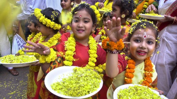 Girls celebrate the Hindu festival of Holi in Kolkata. Millions of girls are "missing" as a result of gender-selective abortions.