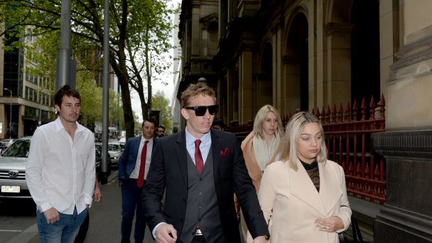 Richard Vincec (centre) arrives to his plea hearing at the Supreme Court.