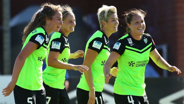 Jenna McCormick, Ellie Brush, Michelle Heyman and Kendall Fletcher of Canberra celebrate after a goal.