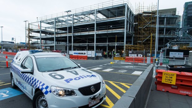 A police car at the South Wharf construction site where a worker was killed on Wednesday.