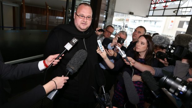 Kim Dotcom speaks to the media following his bail hearing on Monday. 