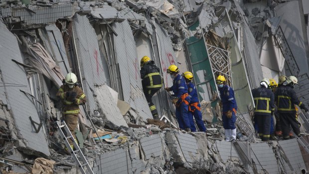 Rescue personnel search for survivors in the Wei Guan building in Tainan, southern Taiwan.