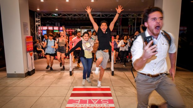 Crowds rush the doors at Myer for the Boxing Day sales last year.