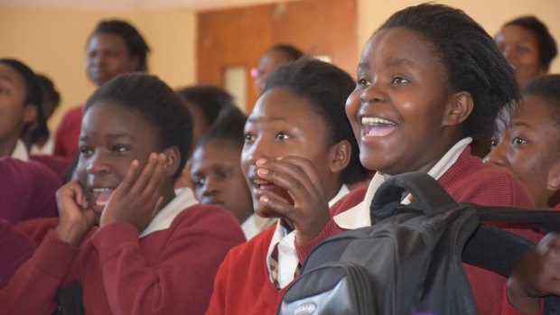 Students react to a science demonstration from Science Circus Africa.