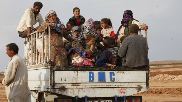 Exodus from Syria: More than 180,000 people have already fled the fighting around Kobane.