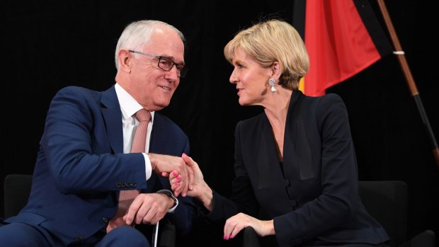 Prime Minister Malcolm Turnbull and Foreign Minister Julie Bishop shake hands during the official launch of the 2017 foreign policy white paper on Thursday.
