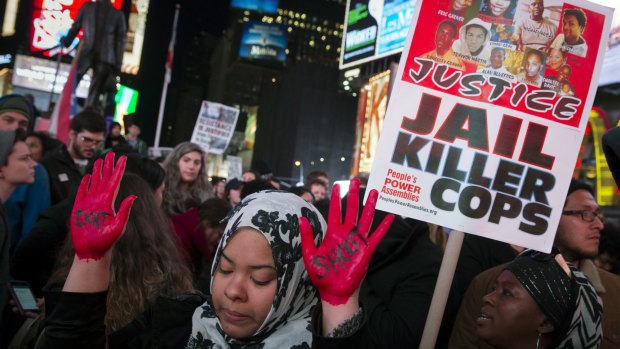 A 2014 protest against a grand jury's decision on Monday not to indict Ferguson police officer Darren Wilson in the shooting of Michael Brown in New York.