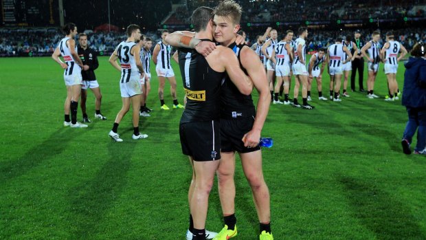 Travis Boak and teammate Ollie Wines after the win over Collingwood.
