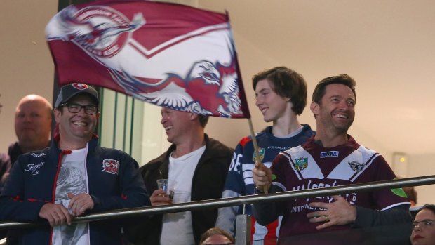 Flying the flag: Hugh Jackman shows his support for the Sea Eagles.