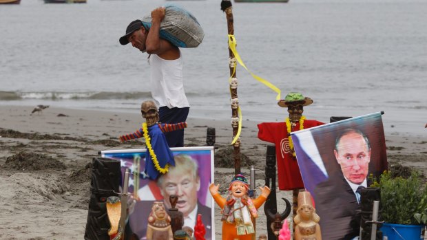 An altar featuring an image of Donald Trump and Vladimir Putin, set up by a group of shamans for their annual pre-New Year ceremony at Agua Dulce, Peru. The shamans have warned their vision of 2017 were filled with doom and gloom.