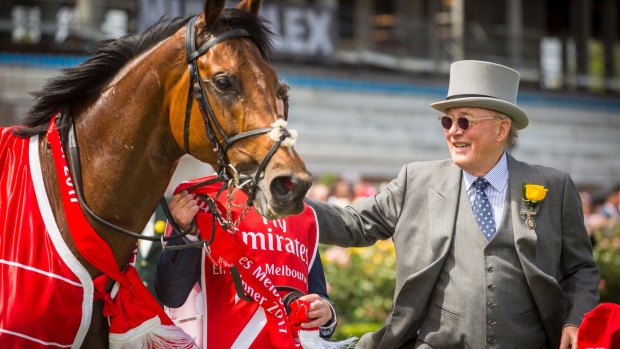 Owner Lloyd Williams greets Rekindling after winning the 2017 Melbourne Cup. 