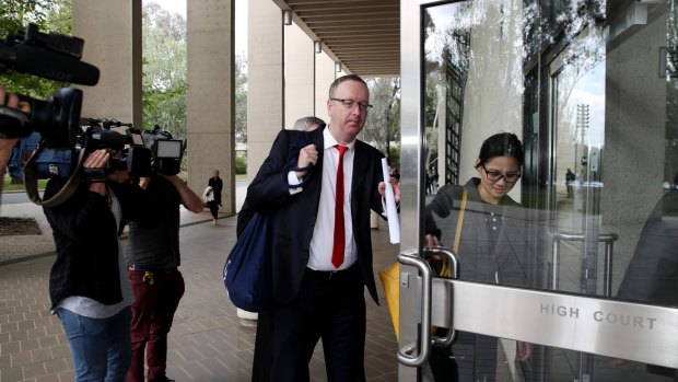 Legal representatives arrive at the High Court in Canberra on Tuesday.