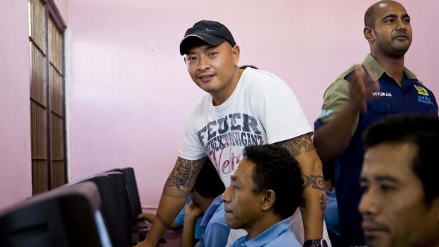 Andrew Chan teaches computer skills to inmates.