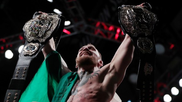 Conor McGregor now holds championship belts in two divisions.
