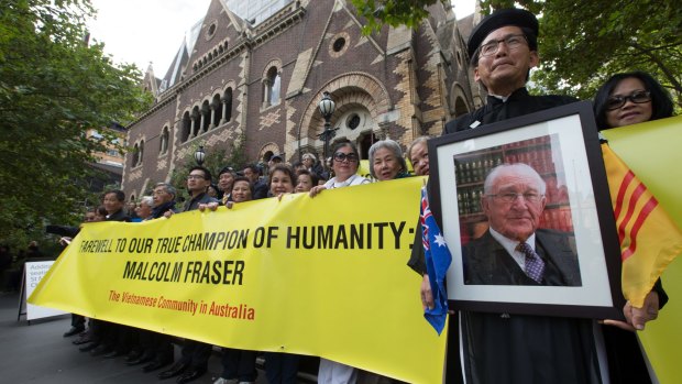 Members of the Vietnamese community are grateful for Malcolm Fraser's kindness and gathered outside Scots Church in Melbourne during the former prime minister's state funeral in March.