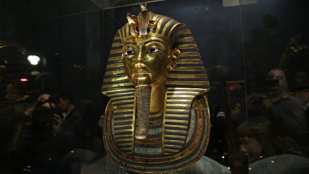 The gold mask of King Tutankhamun in its glass case in the Egyptian Museum near Tahrir Square, Cairo.