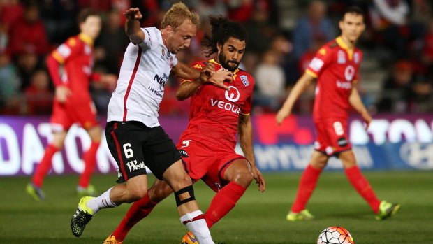 Osama Malik of Adelaide United (right) tangles with Mitch Nichols, but may be heading to Melbourne City.