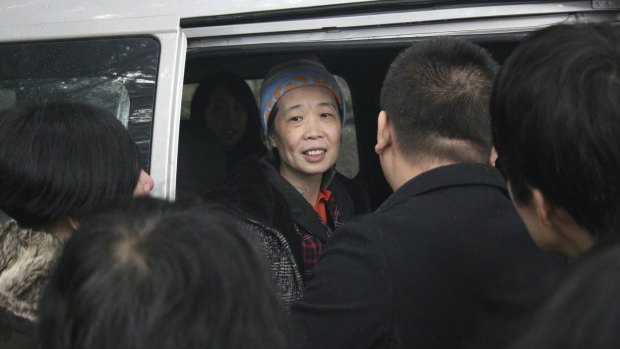 Hard times: Charlotte Chou requested a beanie for her release as her hair had turned almost completely grey during her years in prison.