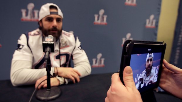 Regular job: New England Patriots defensive back Nate Ebner talks to reporters before last year's Super Bowl.