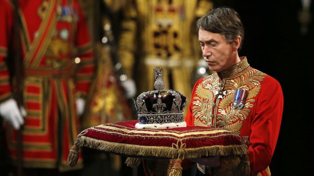 Queen Elizabeth's Imperial State Crown arrives at the State Opening of Parliament in the House of Lords in May.