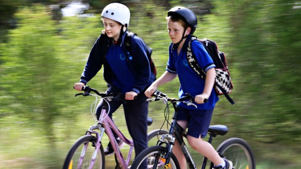 On your bike: 12-year-old Milla and her 10-year-old brother Alonzo are among the minority of children who ride to school. 