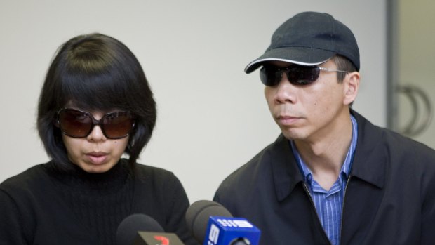 Robert Xie , here with his wife Kathy Lin, make a public appeal about the killings on July 29, 2009