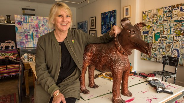 Bentleigh-based artist Pamela Irving with her sculpture Larry La Trobe the dog.