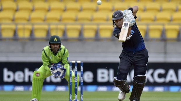Ross Taylor drives uppishly as Sarfraz Ahmed of Pakistan looks on from behind the stumps.
