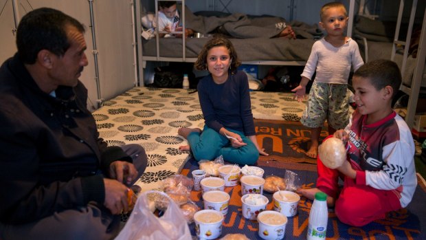 Hiba, 10, with her parents and brothers in their temporary shelter in a migrant reception centre near Gevgelija in the former Yugoslav Republic of Macedonia. 