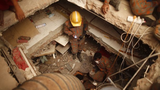 Rescue workers in the Rana Plaza factory after the collapse that killed 1129 workers. 