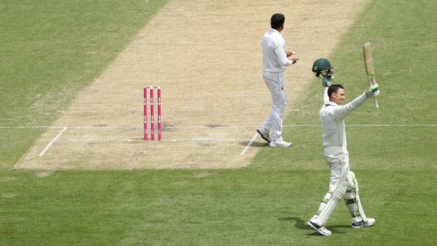 Great knock: Peter Handscomb salutes the crowd after reaching his century.