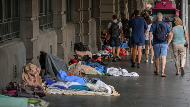 Homeless people camped out near Flinders Street Station. 